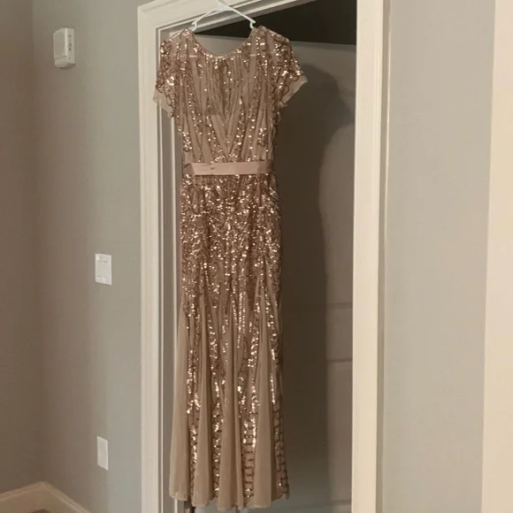 Wore once. Size 6, designer: R&M Richards. Color: Rose gold.